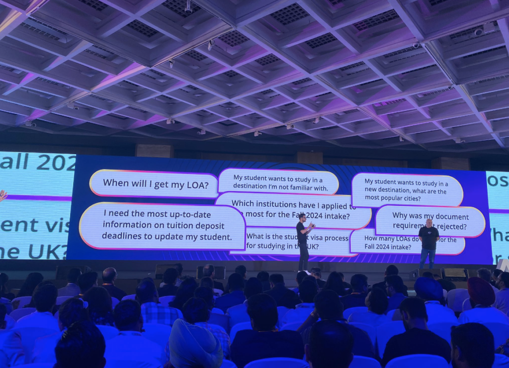 ApplyBoard Co-Founder & President, Massi Basiri, and Chief Recruitment Officer, Scott Harper, revealing Abbie on stage at TRW with a few examples of the questions Abbie can answer.